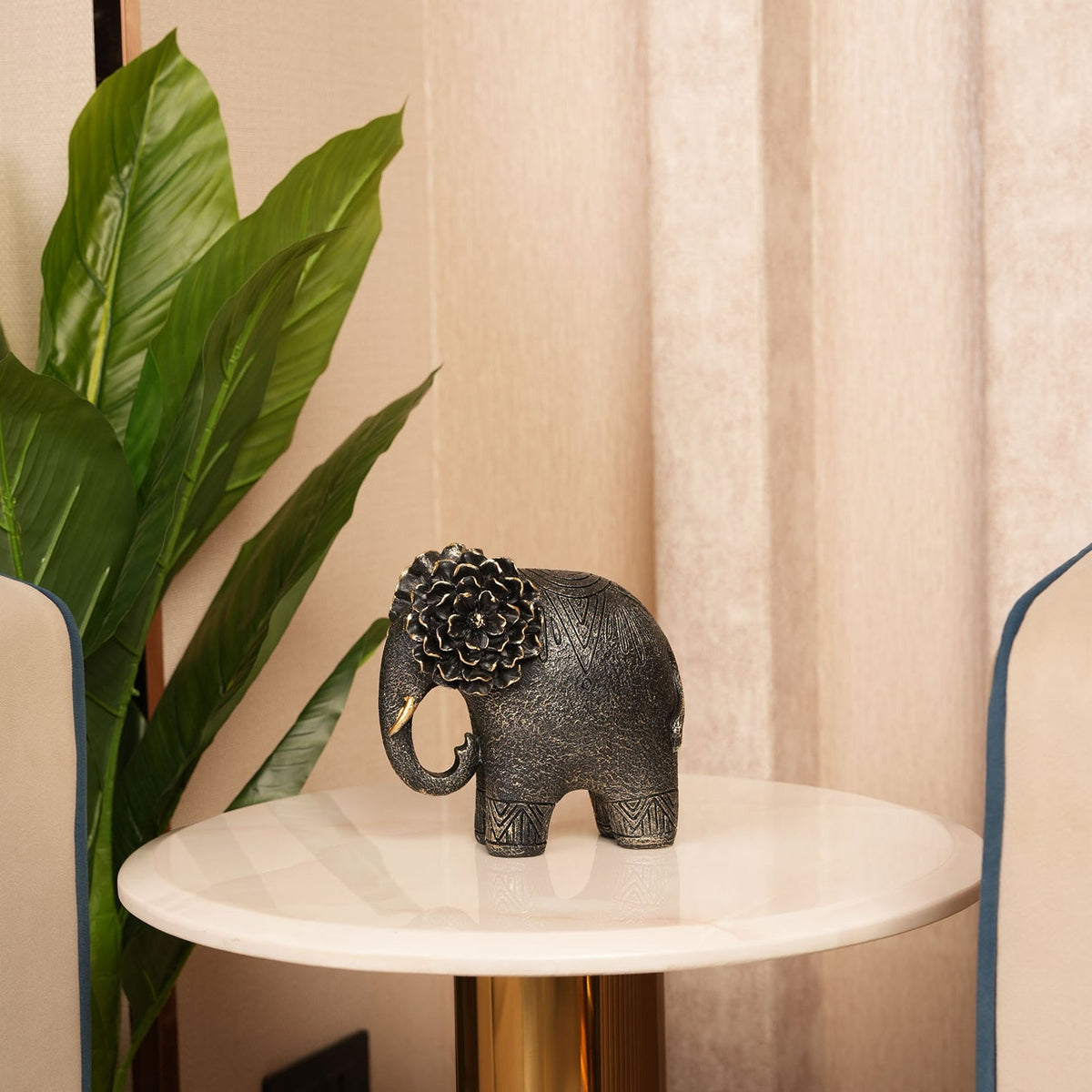 Textured Elephant Sculpture with Flower Headpiece